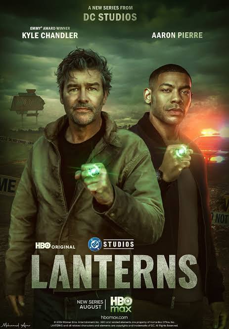 Hal Jordan and John Stewart in regular clothes holding up their glowing green rings.